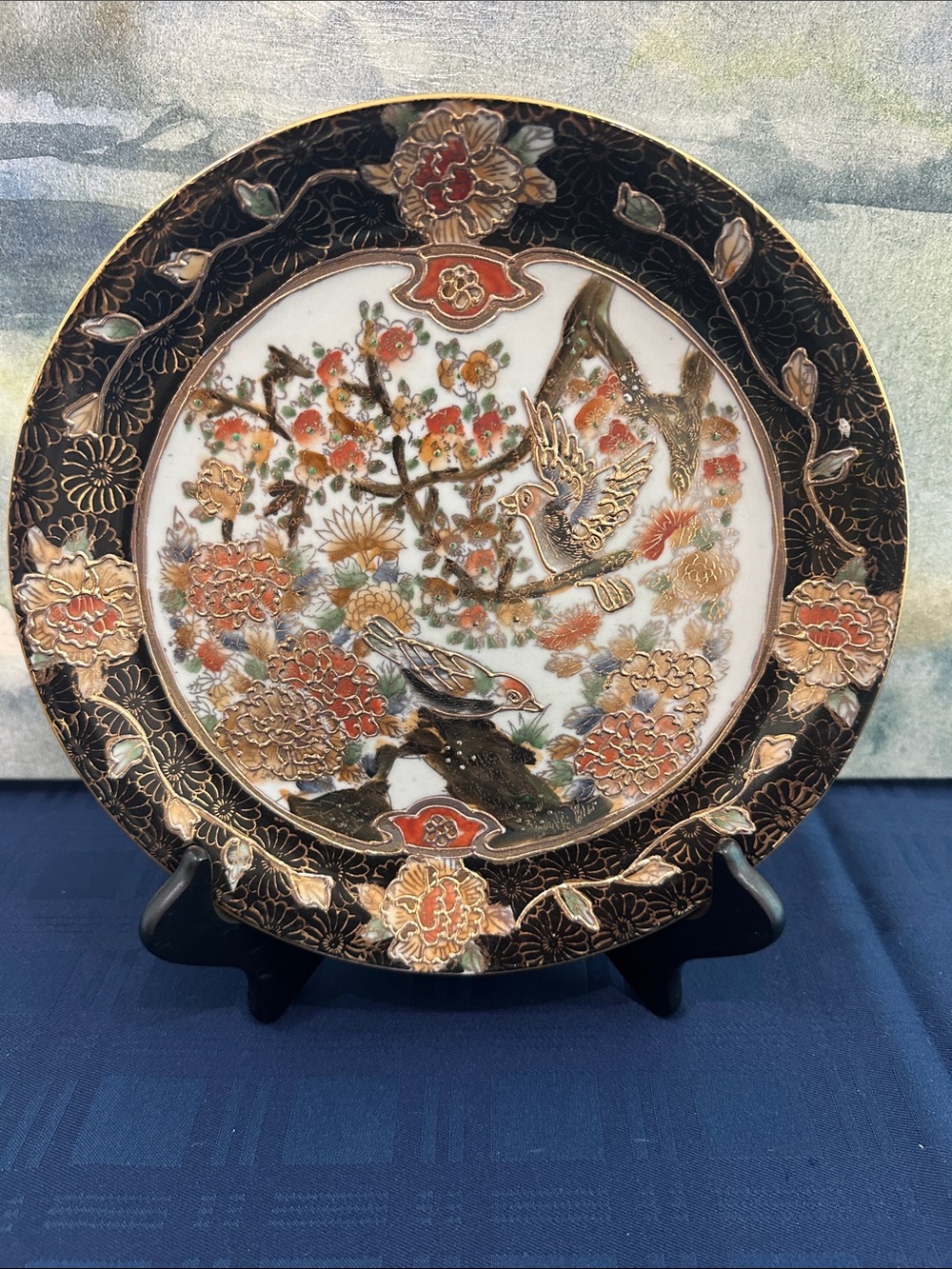 This vintage  Satsuma decorative plate features intricate hand-painted